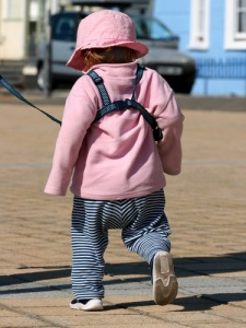Child in walking harness, image © Marilyn Barbone, courtesy of Shutterstock.