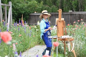 Woman painting at the National Arboretum, taken by Sage Ross, Wikimedia Commons